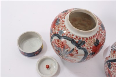 Lot 102 - Pair of Japanese Imari ovoid vases, covers and inner covers