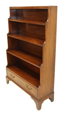 Lot 1316 - Regency mahogany waterfall bookcase, with four graduated shelves and drawer below on bracket feet, 92cm wide x 32cm deep x137cm high