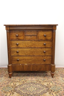 Lot 1319 - 19th century mahogany Scottish chest, having two short drawers flanked by two deep hat drawers and three graduated drawers on stand with single drawer between projecting columns, on spool feet, 133...