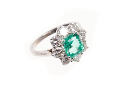 Lot 510 - Fine emerald and diamond cluster ring, the rectangular step cut emerald weighing 1.74cts surrounded by eight brilliant cut diamonds in claw setting on white gold shank. Finger size M1/2. Estimated...