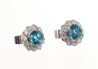 Lot 511 - Pair of blue zircon and diamond cluster earrings