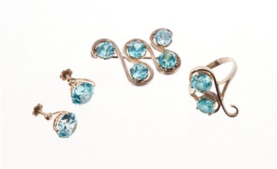 Lot 513 - Pair of blue zircon single stone earrings with a round mixed cut blue zircon measuring approximately 10mm diameter, a blue zircon two stone dress ring and a blue zircon brooch (3)