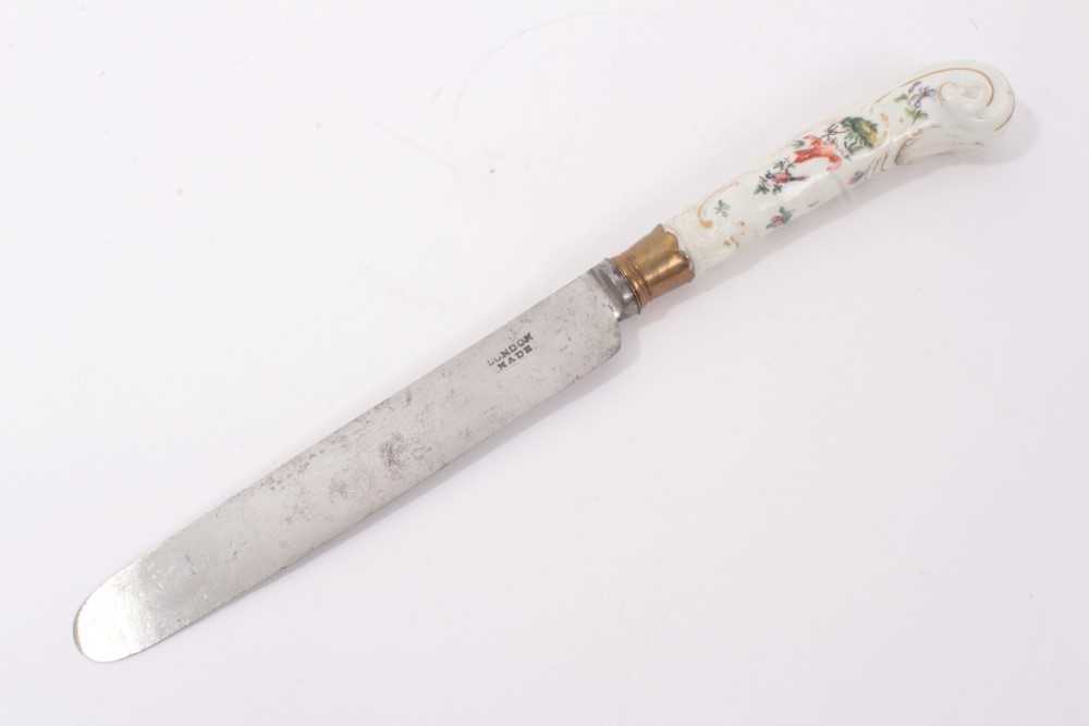 Lot 104 - 18th century Chelsea porcelain handled large table knife with moulded rococo and painted bird and floral decoration 30cm