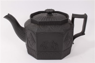Lot 121 - Four early 19th century black basalt teapots including gothic architectural designs (4)