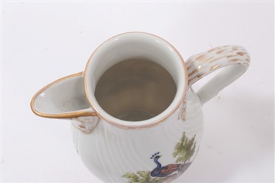 Lot 134 - A Berlin bird painted coffee pot and a milk jug and cover