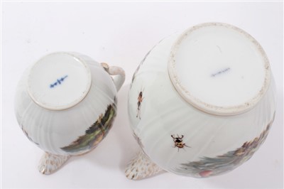 Lot 134 - A Berlin bird painted coffee pot and a milk jug and cover