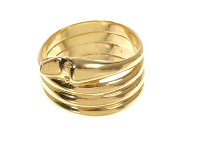 Lot 545 - Gold snake ring with coiled body, finger size S.