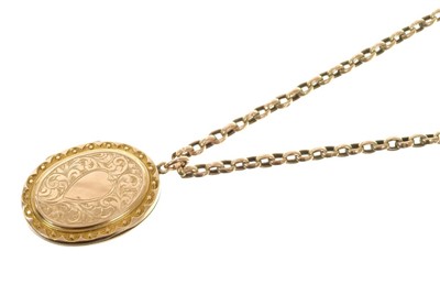 Lot 553 - Edwardian 9ct rose gold locket on a 9ct rose gold belcher link chain