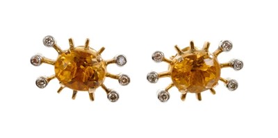 Lot 477 - pair of citrine and diamond cluster earrings, each with an oval mixed cut citrine and six brilliant cut diamonds in gold setting, 20mm