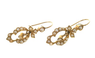 Lot 564 - Pair of Edwardian seed pearl pendant earrings of openwork design, in gold setting. 30mm.