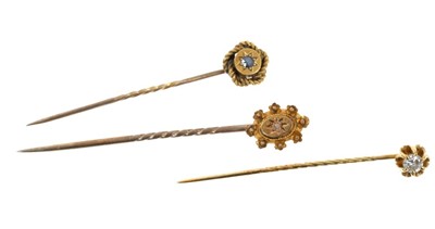 Lot 656 - Three stick pins