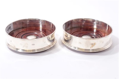 Lot 416 - Two boxed silver wine coasters