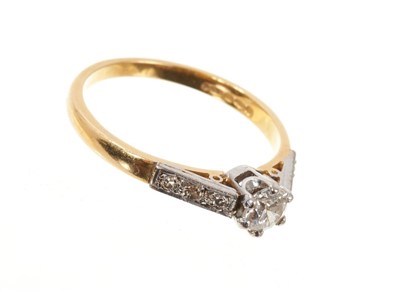 Lot 662 - Diamond single stone ring with a brilliant cut diamond in claw setting and diamond set shoulders