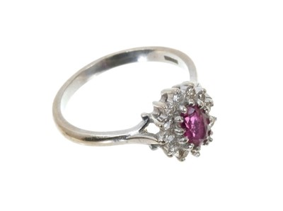 Lot 664 - Ruby and diamond cluster ring