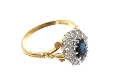 Lot 665 - Sapphire and diamond cluster ring