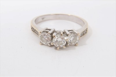 Lot 473 - White gold 18ct diamond three stone ring with diamond set shoulders