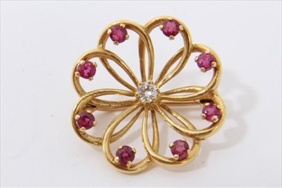 Lot 3249 - 18ct gold brooch with a central brilliant cut diamond and eight mixed cut rubies