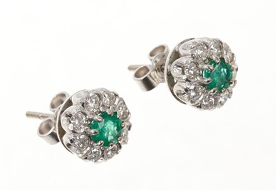 Lot 692 - Pair of emerald and diamond earrings