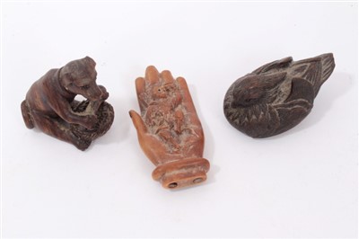 Lot 1114 - Three Japanese carved wooden netsukes