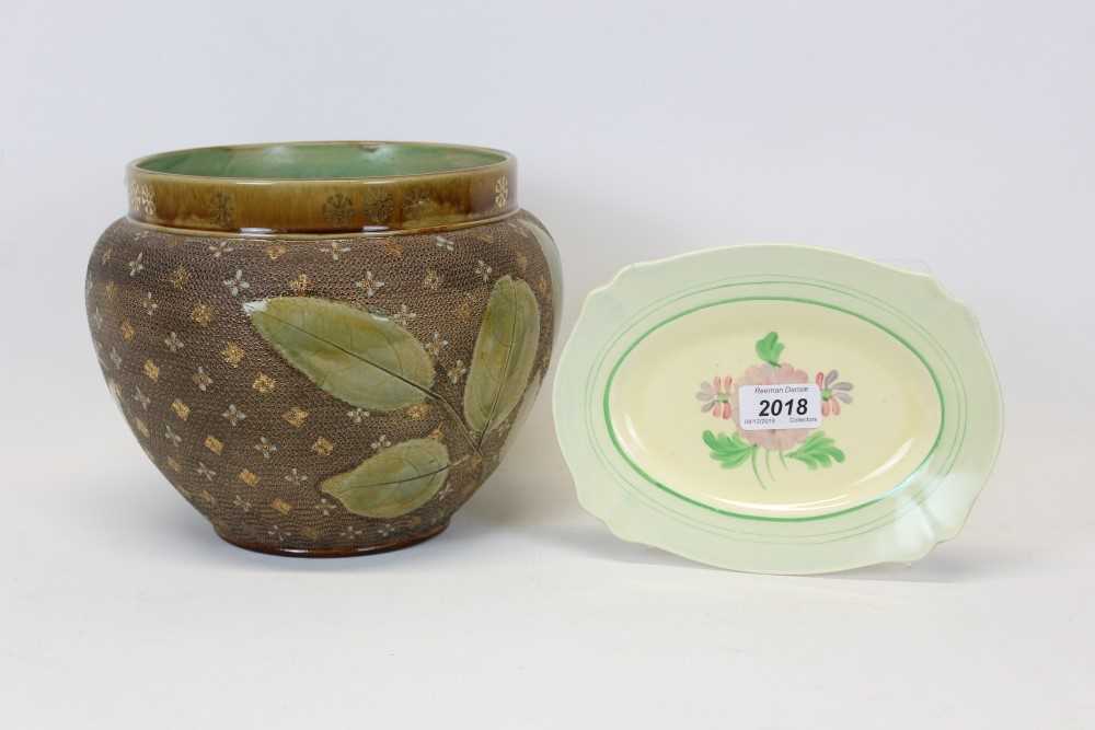 Lot 2018 - Royal Doulton Stoneware Jardinière with leaf decoration together with a Clarice Cliff plate (2)