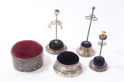 Lot 406 - Four silver and one silver plated pin cushions and hat pin holders (5)