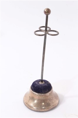 Lot 406 - Four silver and one silver plated pin cushions and hat pin holders (5)