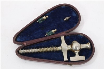 Lot 25 - Early 20th century white metal champagne tap, in leather covered case