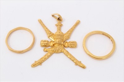 Lot 3276 - Two gold 22ct wedding rings and an Indian Gurkha gold pendant