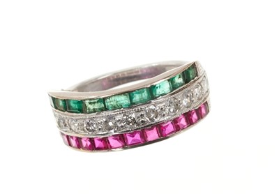 Lot 647 - Diamond, ruby and emerald triple row ring