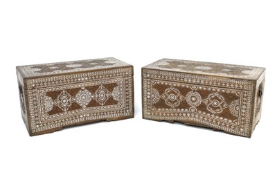 Lot 1622 - Unusual near pair of Eastern carved sandalwood and mother-of-pearl inlaid trunks