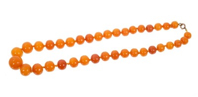 Lot 607 - Antique amber bead necklace