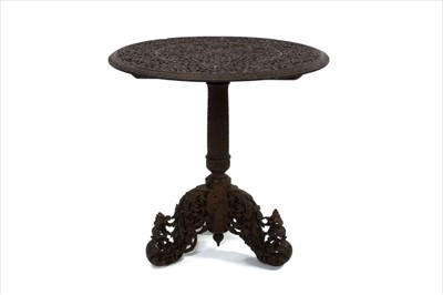 Lot 1722 - 19th century Indian carved circular table on tripod base