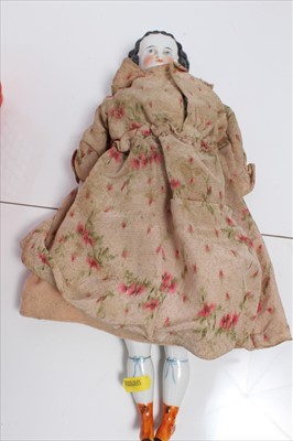 Lot 2709 - 1830 White china doll with moulded hair in original clothing.