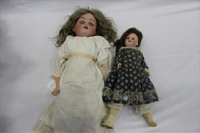 Lot 2706 - Two Dolls including a small French doll SPBJ 60 Paris with composite body and limbs.