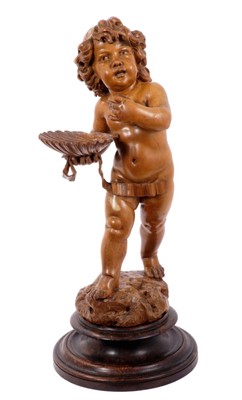 Lot 1189 - Well carved pine figure of a putto with shell in hand on wooden base