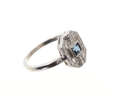 Lot 672 - Art Deco style sapphire and diamond cocktail ring, the octagonal openwork bezel with a square cut blue sapphire and brilliant cut diamonds in mille grain setting on white gold shank. Finger size J1...