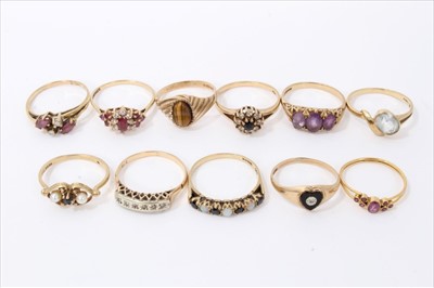 Lot 3215 - Eleven gold (9ct) gem set dress rings