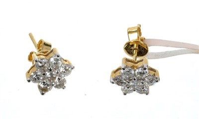 Lot 755 - Pair of diamond cluster earrings, each flower head cluster with 7 brilliant cut diamonds in 18ct gold setting. Estimated total diamond weight approximately 1 carat.