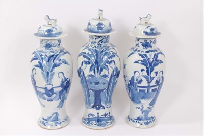 Lot 354 - Garniture of three Chinese Blue and White Porcelain vases and covers with Figural decoration, one with character marks to base