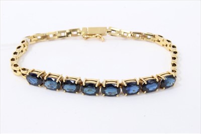 Lot 3358 - Gold (stamped 14k) synthetic blue sapphire bracelet