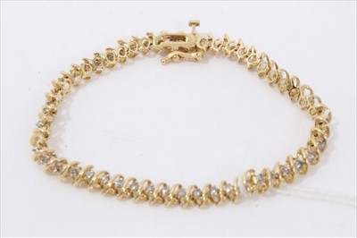 Lot 3360 - Gold (stamped 14k) diamond set bracelet