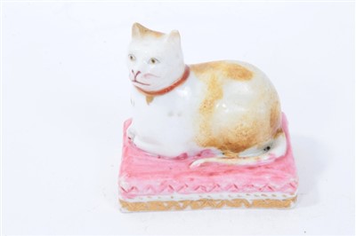 Lot 258 - Unusual early 19th century Derby model of a recumbent tabby cat