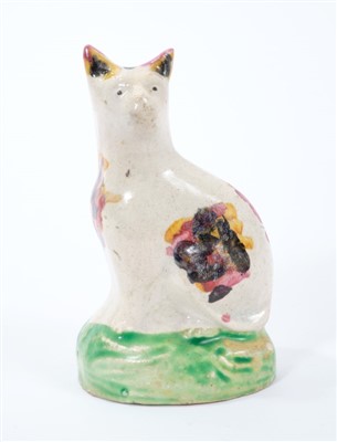 Lot 261 - Late 18th century Staffordshire creamware model of a seated cat