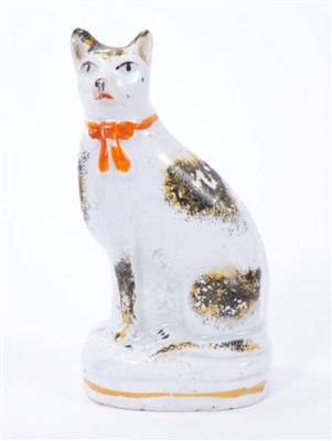 Lot 264 - Mid 19th century Staffordshire model of a cat
