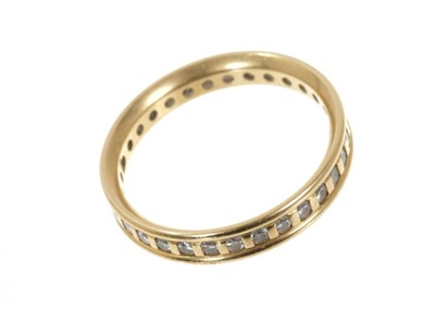 Lot 668 - 18ct gold and diamond eternity ring with a full band of 33 brilliant cut diamonds in 18ct yellow gold setting. Estimated total diamond weight approximately 0.33ct.