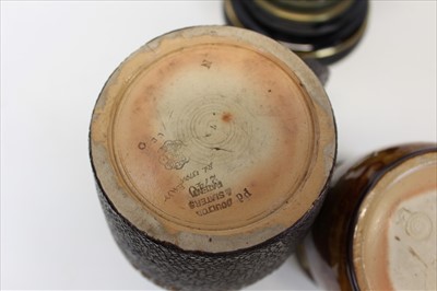 Lot 2050 - Edwardian Royal Doulton oil lamp, Edwardian Doulton tobacco jar and a Doulton Slater’s Patent ‘leather’ jug (3)