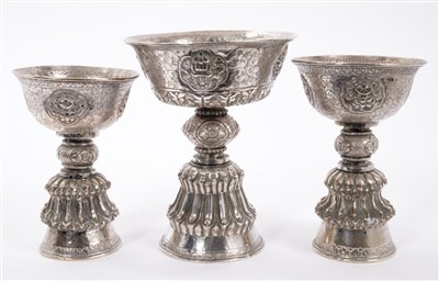 Lot 447 - Three Eastern revolving white metal drinking cups