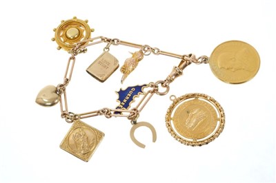 Lot 713 - Gold charm bracelet