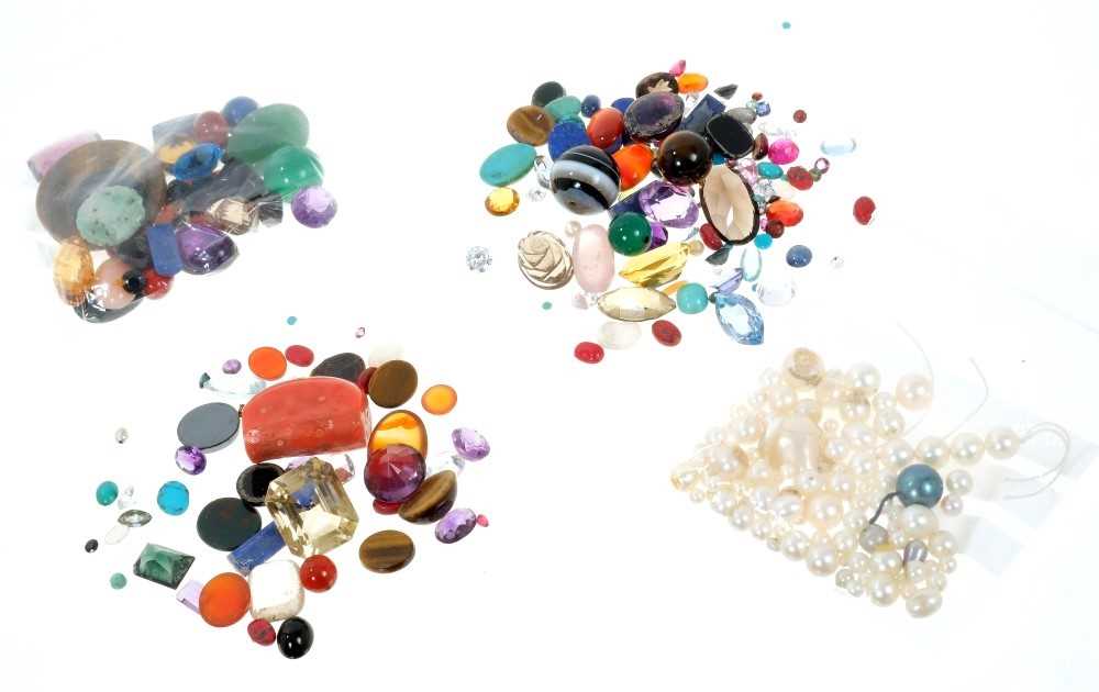 Lot 758 - Four packets of unmounted gemstones to