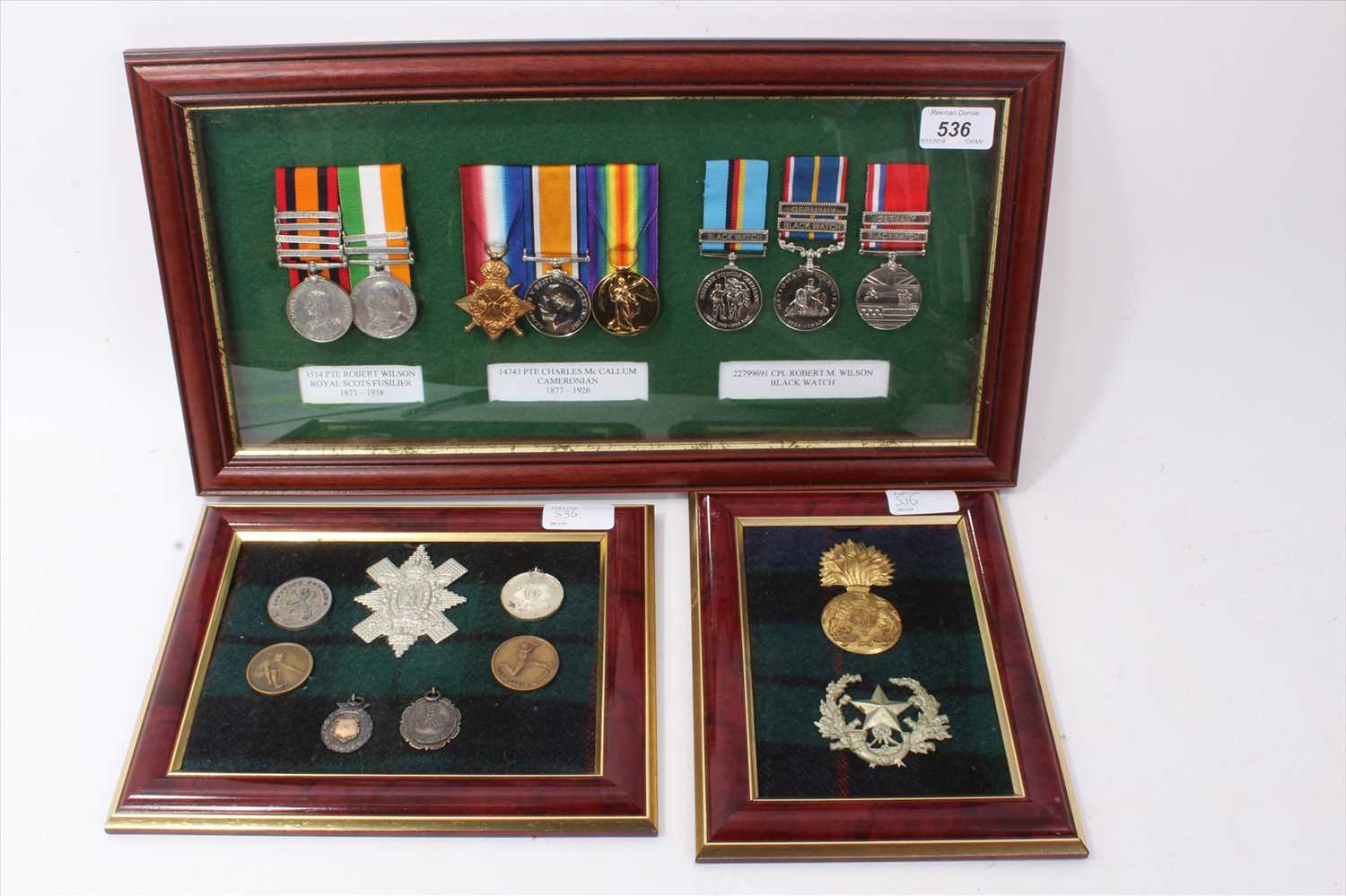 Lot 536 - Group of replica medals mounted in glazed frame, together with badges (3 frames)